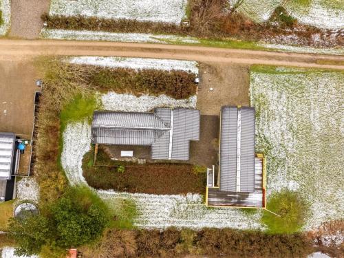 an overhead view of a building in a yard at Holiday Home Ung - 650m to the fjord by Interhome in Struer