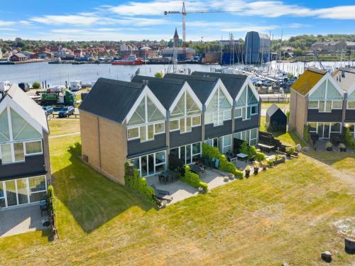 an aerial view of a house with a marina at Holiday Home Claudine - 90m from the sea by Interhome in Assens