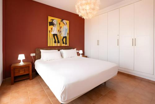 Una cama o camas en una habitación de Villa de los Sueños