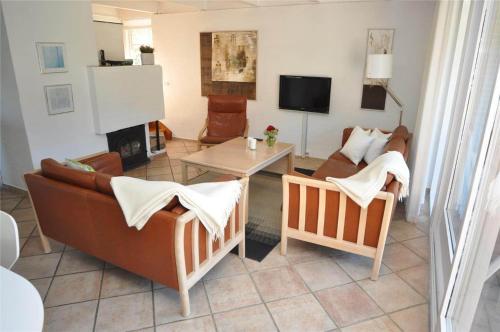 a living room with a couch and a table at 20040-Ulfborg-Sundhuse-15 in Ulfborg