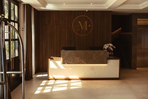 a lobby with a reception desk in a building at Pousada Murano in Campos do Jordão