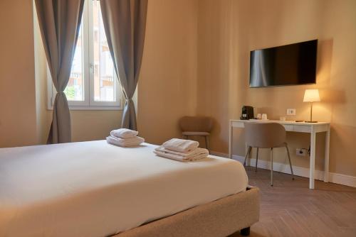 Ένα ή περισσότερα κρεβάτια σε δωμάτιο στο BNB The Nymph and Africo Beccaria