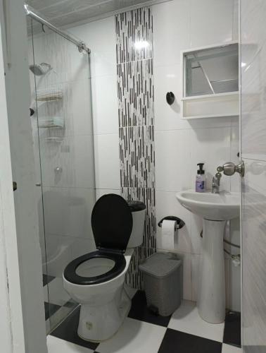 a bathroom with a toilet and a shower and a sink at Casa S&J in Mompos