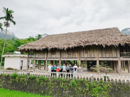 a group of people standing in front of a building at Gia Trang Heian Hoa Binh in Hòa Bình
