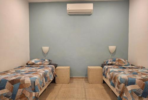 Postel nebo postele na pokoji v ubytování Villa Tropical 191