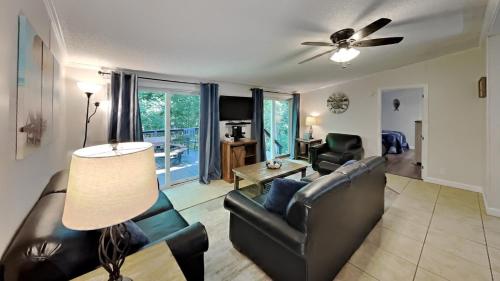 a living room with a couch and a ceiling fan at Put-in-Bay Island Club #97 in Put-in-Bay