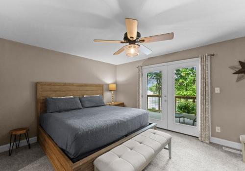 a bedroom with a bed and a ceiling fan at Perfect Family Meeting Place Big Views Private in Sherrills Ford