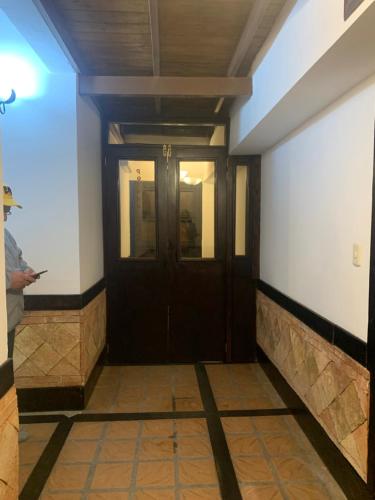 a hallway with a door in a building at Posada Karorita 