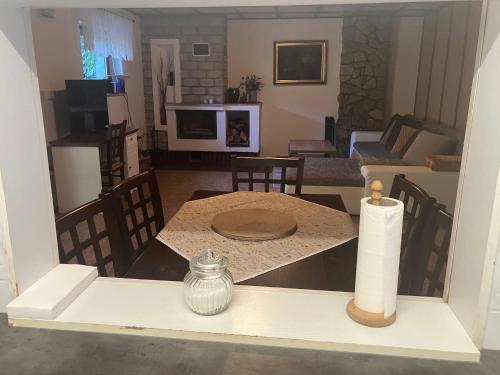 a kitchen and living room with a table and a candle at Ubytování ve vinici in Hustopeče