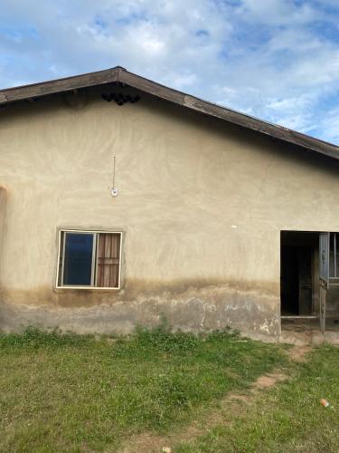 a large building with a window and a door at Mansion in Akure