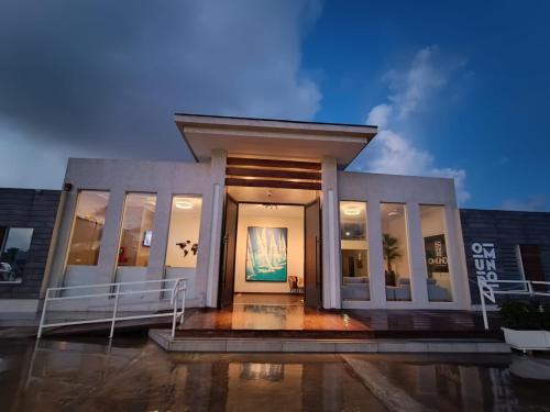 a building with a large door with a painting on it at Aruba Boutique & Art Hotel - Adults Only in Palm-Eagle Beach