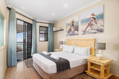 Ένα ή περισσότερα κρεβάτια σε δωμάτιο στο Bali Hai 103 by Host Agents