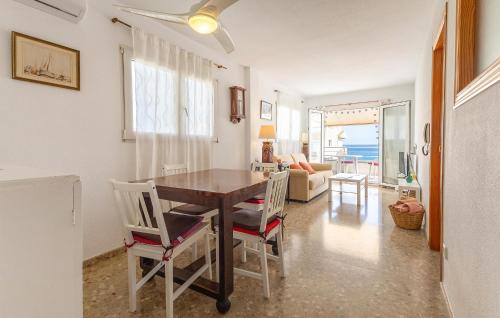 a dining room with a table and chairs at Amazing Apartment In Altea With Kitchen in Altea