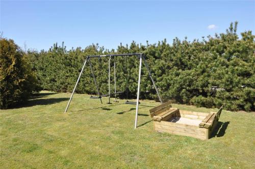 an empty swing set in a field with a swing set at 30070-Ulfborg-Klovervej-478 in Vang