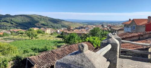 a view of a small town from a building at Apartamentos Rurales La Lancha in Aldeanueva de la Vera