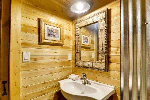 a bathroom with a sink and a mirror at West Kootenai Cabin in Amish Country! in Rexford