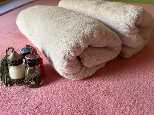 a white towel and two salt and pepper shakers at Casa Indigo Blue Jeri in Jericoacoara
