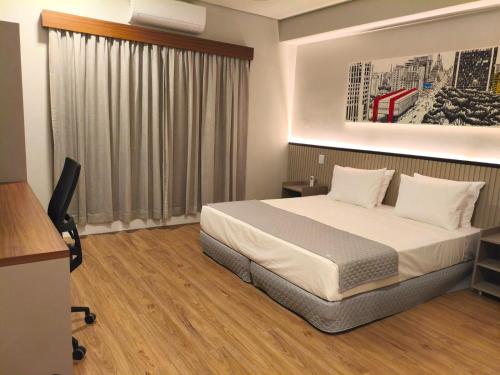 Hotel 28 Embu das Artesにあるベッド
