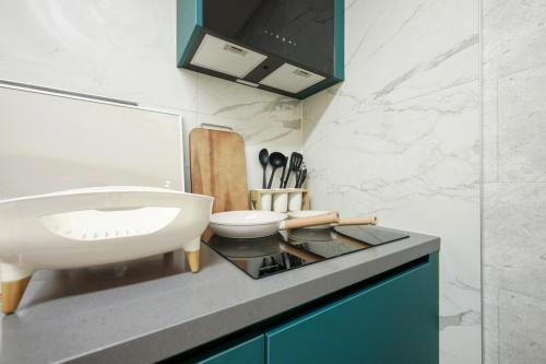 a bathroom with a sink and a toilet on a counter at Busan Jeonpo Station 3min Rooftop Stay in Samgong