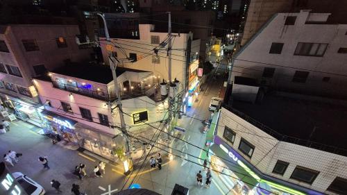 an overhead view of a city street at night at Busan Jeonpo Station 3min Rooftop Stay in Samgong