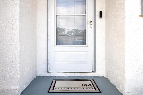 a door with a welcome mat in front of it at The Villages of Seaport 144 in Cape Canaveral