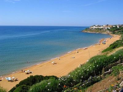 a beach with a group of people on it at L'isola di Gaia in Crotone
