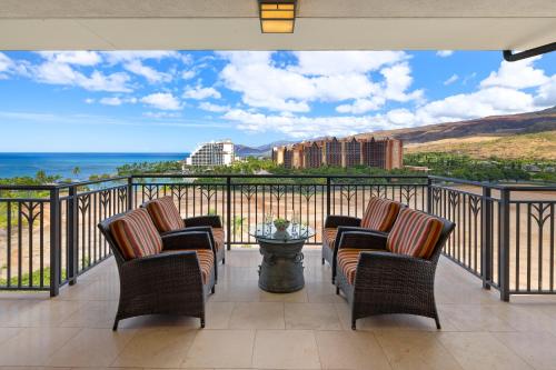 a balcony with chairs and a view of the ocean at Ko Olina Beach Villas B1101 in Kapolei