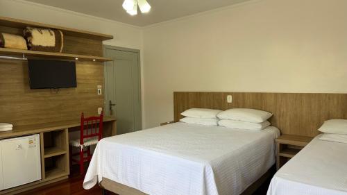 Postel nebo postele na pokoji v ubytování Pousada Tedesco