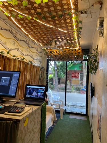a room with a desk with a computer on it at Massaji&SPA-Massage Spa in Oslob