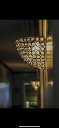 a light hanging from a ceiling in a room at Boone Trace Inn Room 4 in Pineville