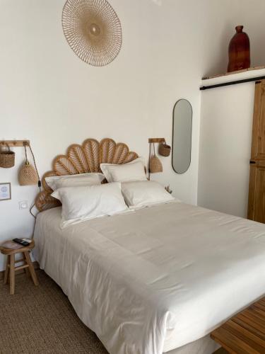 Ένα ή περισσότερα κρεβάτια σε δωμάτιο στο O'Manava Lodge et Bien-Etre