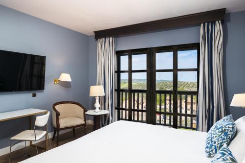 Ein Bett oder Betten in einem Zimmer der Unterkunft RL Ciudad de Úbeda
