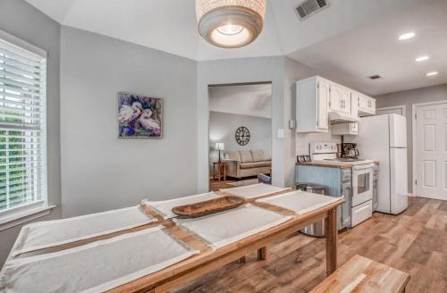 a kitchen with a table and a refrigerator at Dedo Days Retreat in Bartlett
