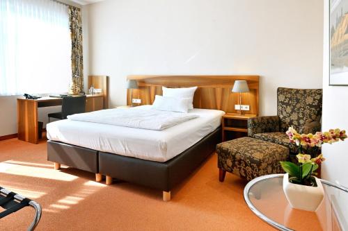 Ένα ή περισσότερα κρεβάτια σε δωμάτιο στο Hotel Lindenhof
