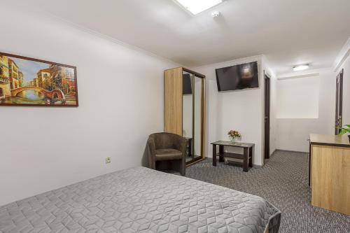 Ένα ή περισσότερα κρεβάτια σε δωμάτιο στο Venus hotel