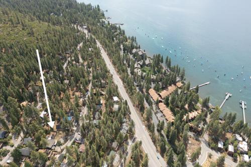 an aerial view of a beach with boats in the water at Bluejay Hideaway by Tahoe Getaways - Kings Beach 3 BR Pet Friendly w Enclosed Yard and Hot Tub in Brockway Vista