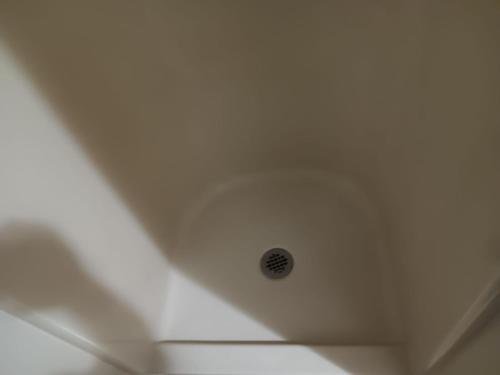a white ceiling with a shower in a room at Bonita Bungalow in Huntsville