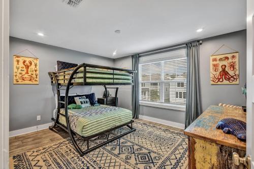 a bedroom with a bunk bed and a window at 28 Hammock Breeze Way in Hilton Head Island