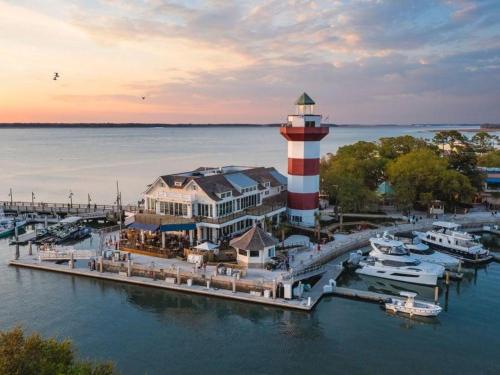 an aerial view of a lighthouse in a marina at 28 Hammock Breeze Way in Hilton Head Island
