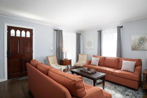 a living room with a couch and a table at 4th St Little Blue in Bham in Graymont