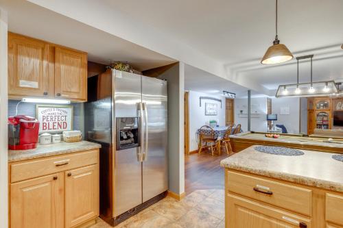 a kitchen with a large stainless steel refrigerator at Foxes Den with Hot Tub, Pool Table and Fire Pit! in Troy