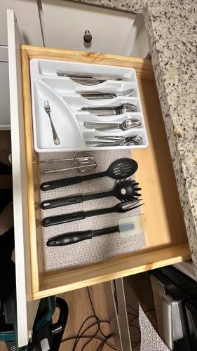 a drawer filled with knives and utensils at 12th Ave The Bricks - Unit 4 in Birmingham