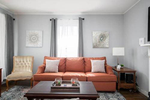 a living room with a couch and a coffee table at 4th St Little Blue in Bham in Graymont