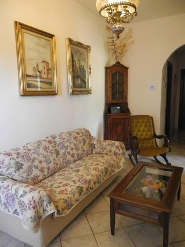 a living room with a couch and a coffee table at La Spezia Marola Un Borgo Sul Mare in La Spezia