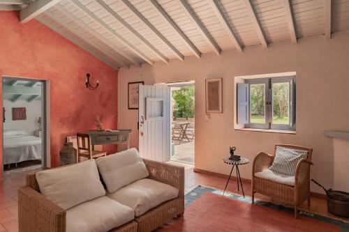 a living room with a couch and a table at CABRA - Porto Covo in Porto Covo