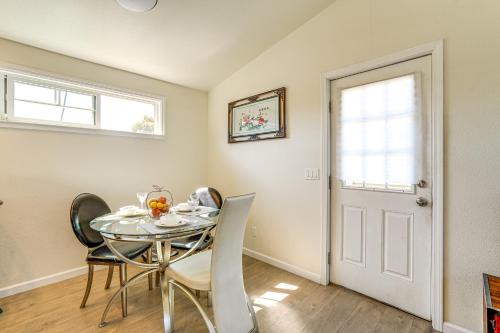 a dining room with a glass table and chairs at Walk to Dimond District Gems Home in Oakland in Oakland