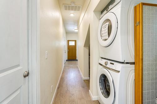 a laundry room with a washer and dryer at Walk to Dimond District Gems Home in Oakland in Oakland
