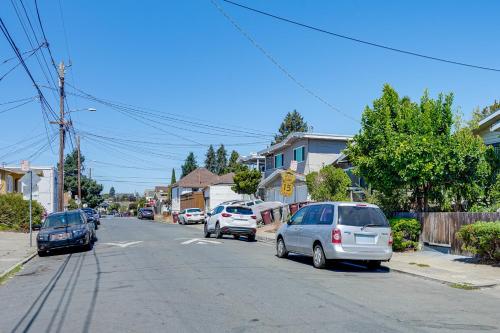 a street with cars parked on the side of the road at Walk to Dimond District Gems Home in Oakland in Oakland