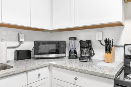 a kitchen counter with a microwave and a blender at 12th Ave The Bricks - Unit 4 in Birmingham