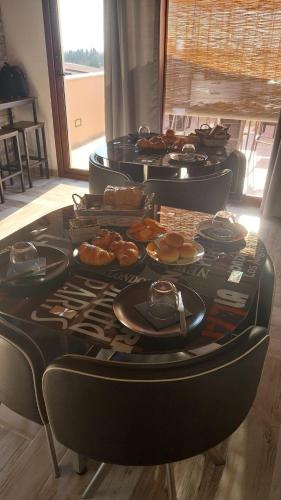 a table with a bunch of food on it at Affittacamere BaLu in Guspini